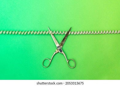 Phone Cord Being Cut By Scissors. Concept Disconnected Communication