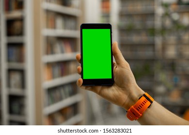 Phone With Green Chromakey Screen In Hand Of Male