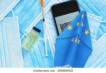 Phone With Green Pass Qr Code, Vaccine Ampoule And Syringe, Face Mask,, Paper Plane In EU European Union Flag - Concept New Rules For Tourism And Travel Between European Countries