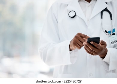 Phone, hand and doctor browsing social media online using wifi in a medical hospital for research. Analysis, cellphone and typing text for contact in healthcare clinic with the hands of a gp
