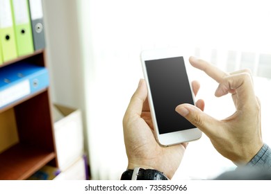 The phone is in the hands of the executives who are using it. - Shutterstock ID 735850966