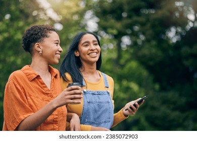 Phone, happy and women in park with coffee together for holiday, bonding and quality time outdoors. Friendship, nature and female people walking in nature for relaxing, conversation and talking - Powered by Shutterstock