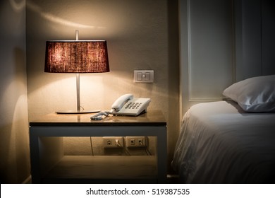 Phone And Lamps On Side Table In Hotel Bedroom View Details With Bed .