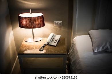 Phone And Lamps On Side Table In Hotel Bedroom View Details With Bed .