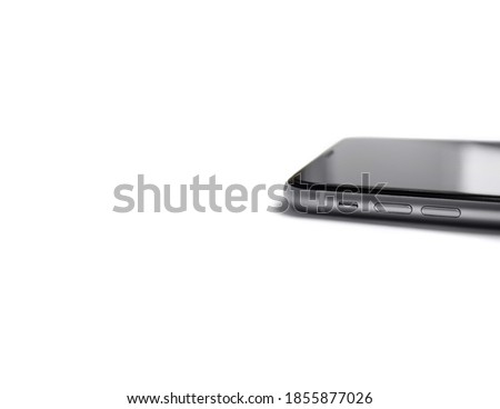 The phone lies sideways on a white background.  Macro shooting.  Isolated.  Side view.