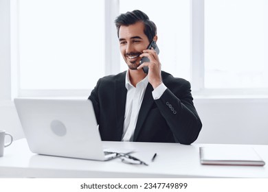 Phone man laptop computer talk businessman office - Powered by Shutterstock