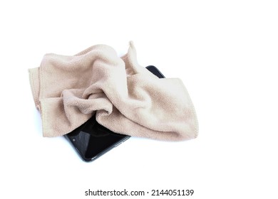 The Phone And Microfiber Cleaning Cloth On A White Background.