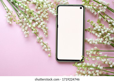 phone mockup with spring blossom.  digital invitation with lily of the valley - Shutterstock ID 1719224746