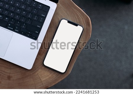 phone on a wooden table with a place for a signature