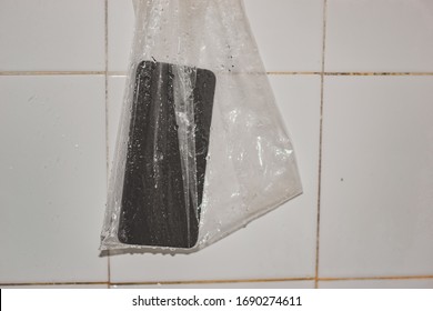 The Phone In A Plastic Bag Prevents Water From Entering The Phone.