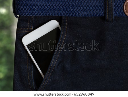 Phone Pocket  smart mobile Communication  in  jeans Copy Space