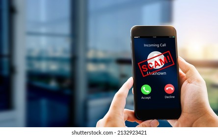 Phone Scam, Fraud Or Phishing Concept.Unknown Caller Show On Mobile Phone Screen.