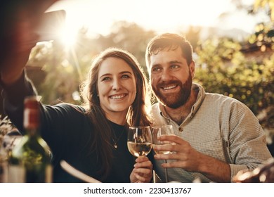 Phone selfie, wine toast and couple on romantic love date for marriage anniversary, outdoor freedom or peace. Picture flare, fine dining and wine tasting man and woman bonding at vineyard restaurant - Powered by Shutterstock