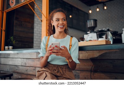 Phone, social media and coffee shop with a woman customer thinking of an idea while sitting at a counter in a cafe. Mobile, internet and communication with a young female sitting in a restaurant - Powered by Shutterstock