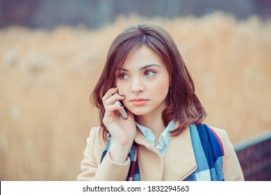 Phone Talk. Closeup Portrait. Serious Woman Talking On Mobile Phone Outside Outdoors On Autumn Park Background, Professional Conversation, Smart Business People Concept