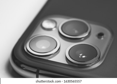 Phone with a triple camera isolated on white background
