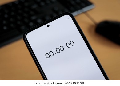 Phone white stopwatch timer to study on office keyboard, study business background