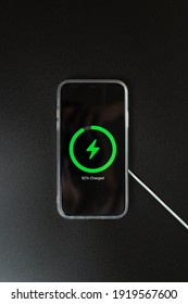 Phone With Wireless Charging On Black Background