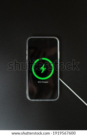 phone with wireless charging on black background