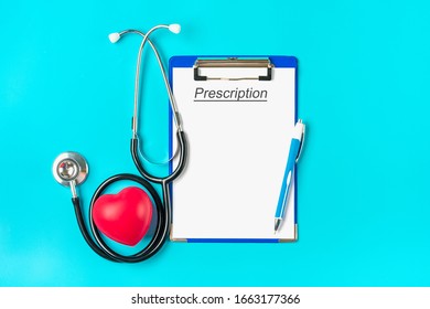 Phonendoscope, Red Heart, Tablet With Blank White Paper, Pen On Blue Background Diagnosis, Health, Life, Medical Prescription, Recipe Concept Top View Flat Lay Mock Up Empty Text