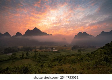 Phong Nam Valley with rice fields and mountains and misty morning sunrise in Cao Bang, Vietnam. - Powered by Shutterstock