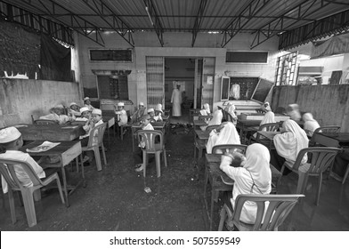 PHONM PENH, CAMBODIA - JUNE 12 2013: Unidentified Muslim students in a classroom in Phnom Penh, Cambodia.