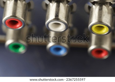 Phono connector sockets of tulip type, multicolored, close-up, selective focus 