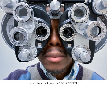 phoropter close up view of ophthalmology, optometry, and optician clinical testing machine equipment against a white background