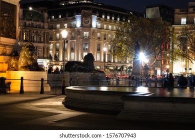 Phot taken trafalgar square London United Kingdom on the 22nd November 2019. Photo portrays night scene with pedestrians at rush hour. The photo shows buildings, staues and historic monuments.