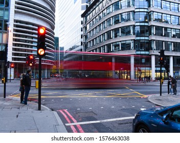 Photgraph taken at Bishopsgate, London, United Kingdom on the 27th November 2019 . Photgraph shows a long exposure at a junction as well as buildings, bus, cars, pedestrians and trtaffic lights.
