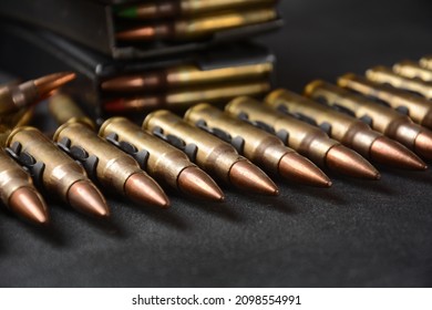 Photo of 5.56mm Ammunition, machine gun bullets belt, rifle ammunition in magazines
