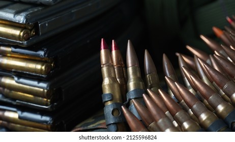 Photo of 5.56mm ammunition, machine gun bullets belt, rifle ammunition 