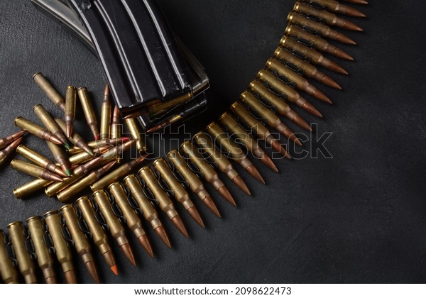 Photo of 5.56mm Ammunition, machine gun bullets\
belt, rifle ammunition in\
magazines