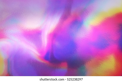 Photo of an abstract colorful holographic futuristic texture.