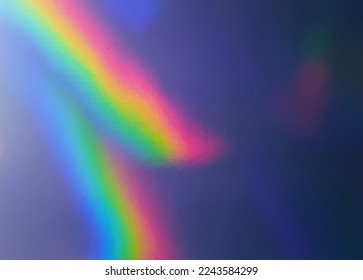 photo of abstract pastel iridescent silver holographic foil background with light leaks. holo color plastic material. cool glitter surface with shiny rainbow feel.