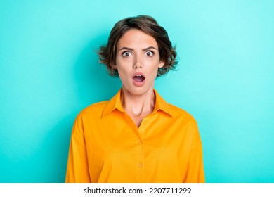 Photo Of Adorable Cute Nice Girl With Bob Hairdo Dressed Yellow Shirt Scared Horrified Staring Isolated On Turquoise Color Background