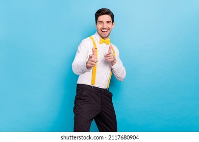 Photo of adorable excited guy dressed white shirt yellow bowtie pointing fingers you isolated blue color background