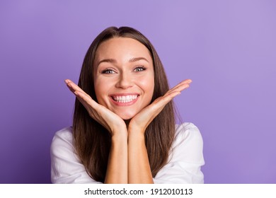 Photo Of Adorable Funny Girl Palms Chin Toothy Beaming Smile Wear White Shirt Isolated Violet Color Background