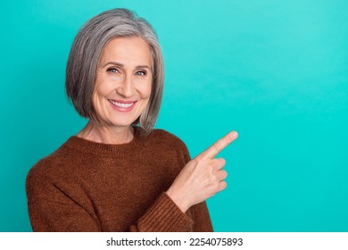 Photo of adorable lady wear brown stylish clothes arm direct empty space toothcare procedure space isolated on cyan color background - Powered by Shutterstock