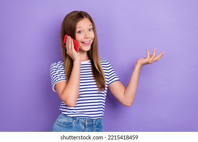 Photo Of Adorable Positive Cheerful Girl With Straight Hairdo Wear Striped T-shirt Talking On Phone Isolated On Purple Color Background