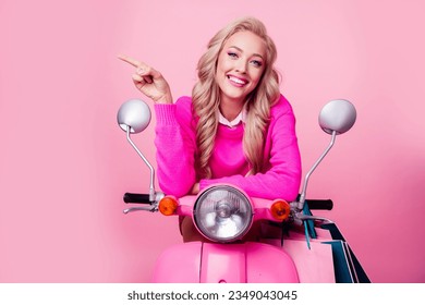 Photo of adorable satisfied lady sit moped dressed stylish clothes recommend offer empty space isolated on pink color background - Shutterstock ID 2349043045