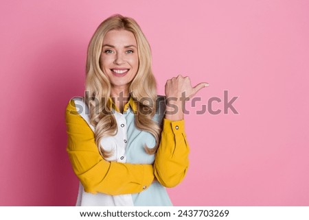 Photo of adorable satisfied woman wear stylish clothes presenting special nice offer brand empty space isolated on pink color background