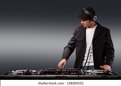 Photo Of Adult Dj Working With His Equipment