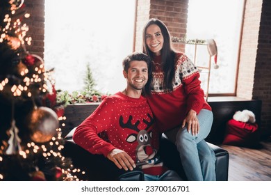 Photo of adult funny couple relaxing sitting on couch new year atmosphere comfortable interior rent christmas vibe studio decorations