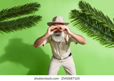 Photo of adventurer senior man watch binoculars glasses observe wildlife tropics isolated green color background - Powered by Shutterstock