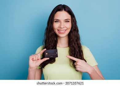 Photo Of Adviser Girl Showing New Debit Card Indicate Forefinger Side On Blue Background