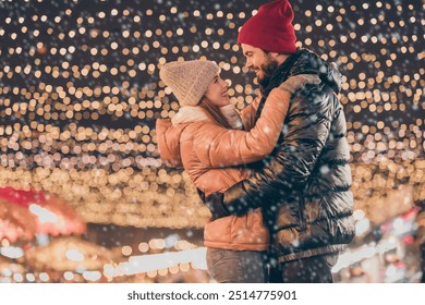 Photo of affectionate couple dance under evening outdoors x-mas christmas lights - Powered by Shutterstock