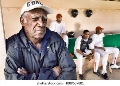 Photo Of African American Baseball Coach Watching From Dugout