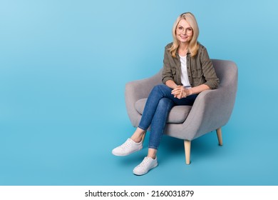 Photo of aged lady psychology specialist sit chair listen client patient isolated blue color background - Shutterstock ID 2160031879