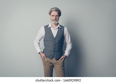 Photo Of Aged Macho Business Man Strict Boss Standing Calm Not Smiling Serious Wear Specs Office White Shirt Waistcoat Trousers Isolated On Grey Color Background